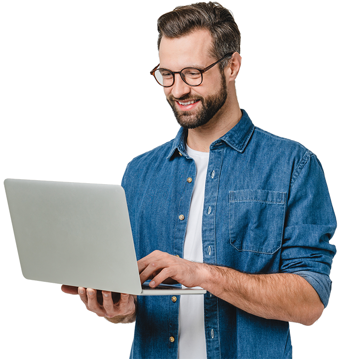 Man smiling holding a laptop